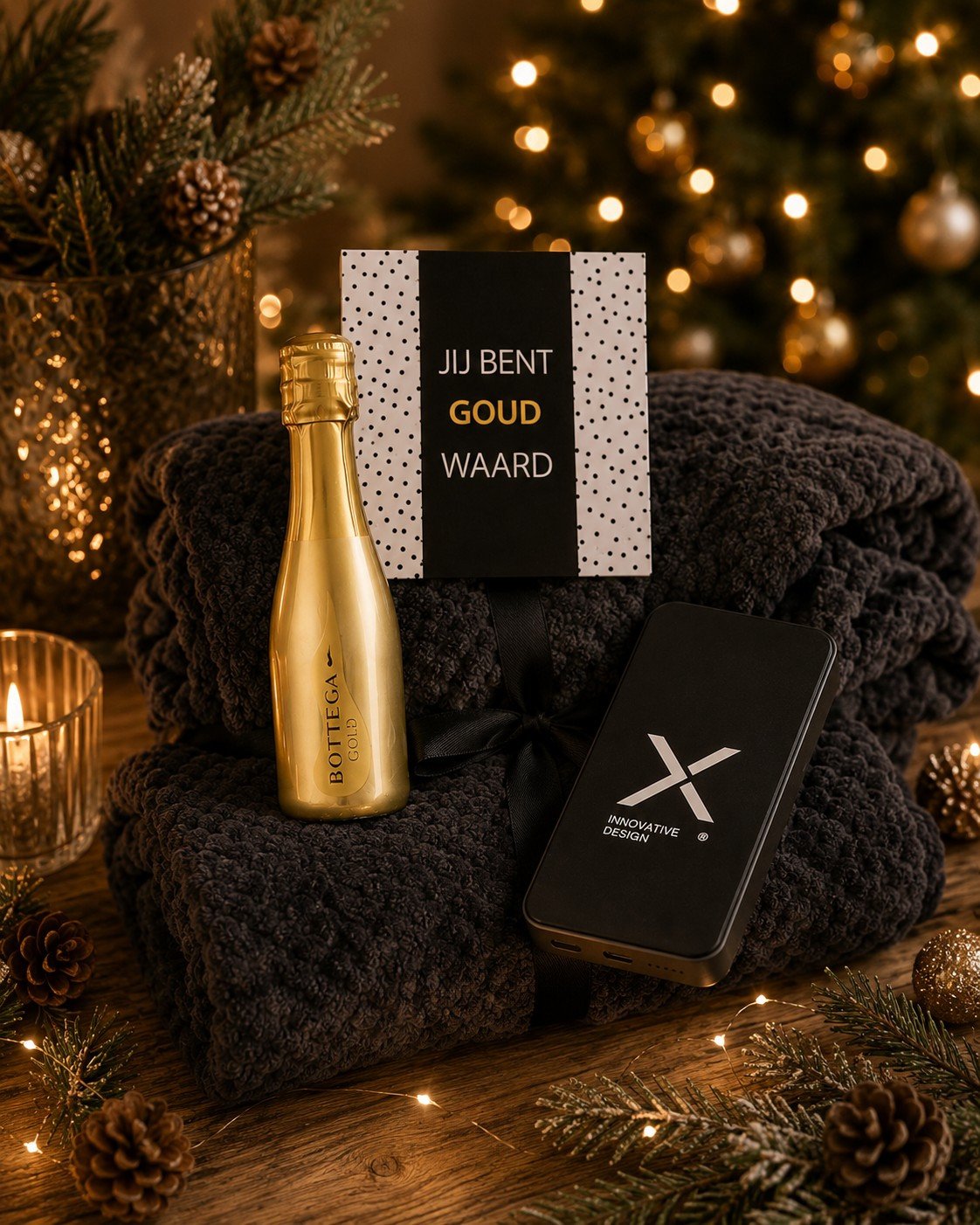 Kerstgeschenk \'jij bent goud waard\' met cava, chocolade, een plaid en powerbank